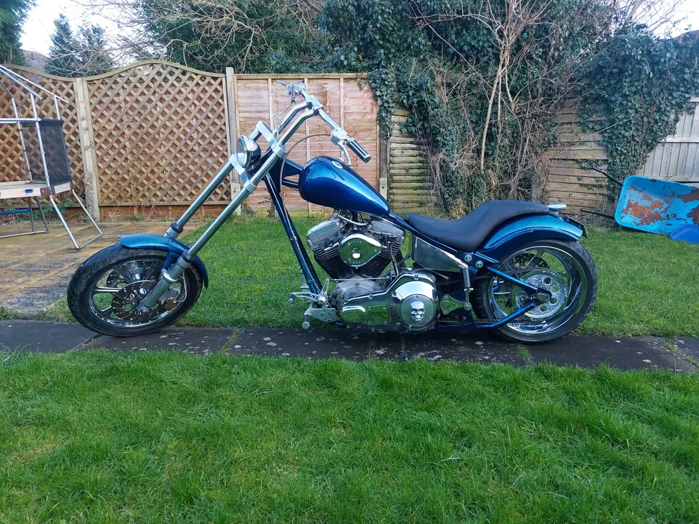Blue long-fork custom chopper motorbike